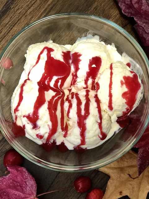 white chocolate ice cream with cranberry sauce